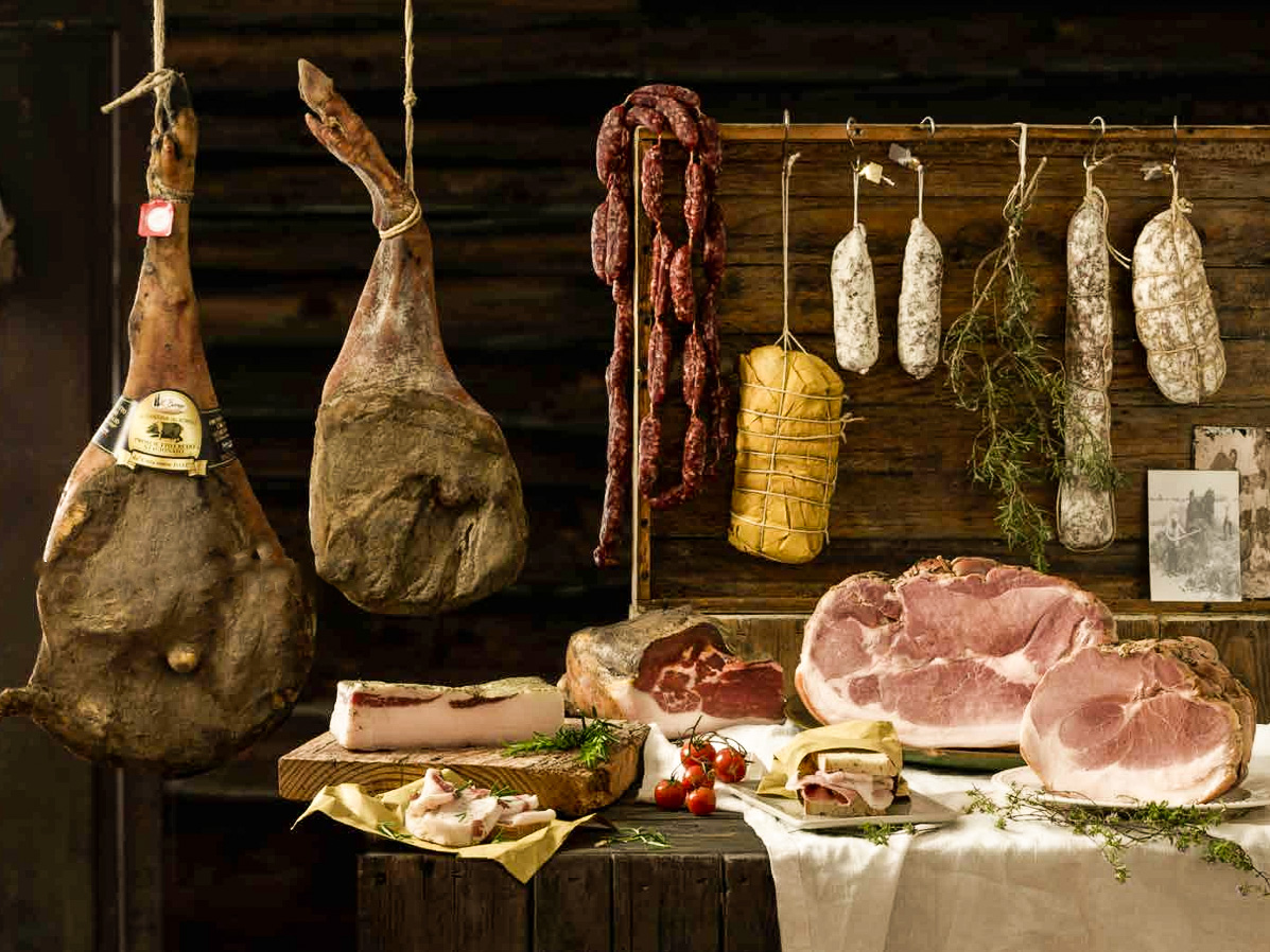 Assortment of Cinta Senese cold cuts on a wooden table