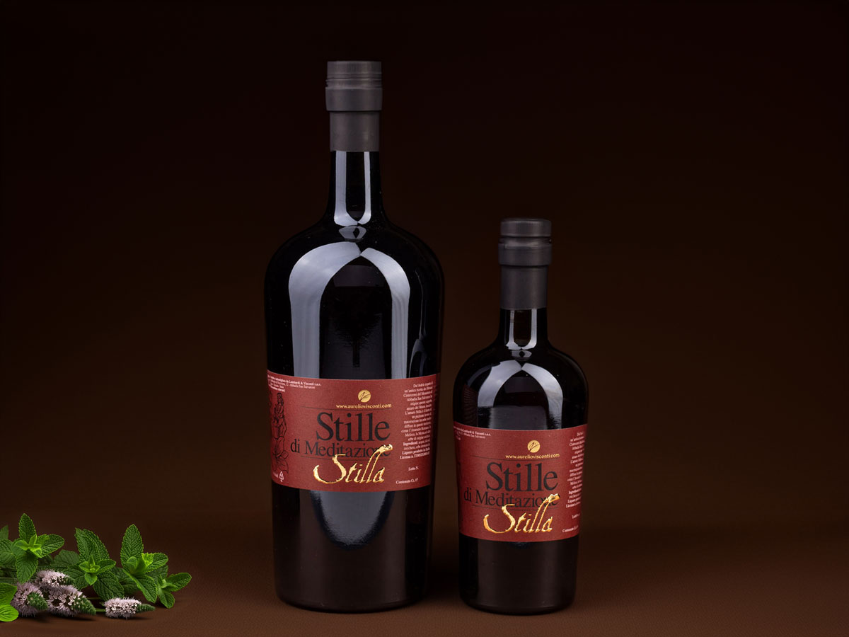 Amaro Stilla herbal liqueur bottle featuring a unique blend of Karkadè, rhubarb, and other botanicals, offering a balanced bitterness and sweetness.