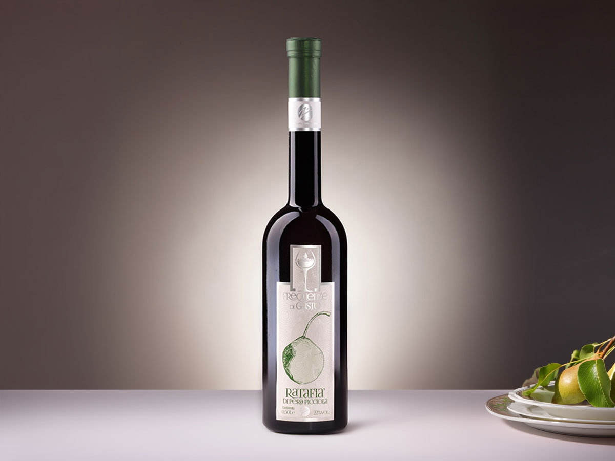 Bottle of Ratafia di Pera Picciola, a rare Italian pear liqueur crafted from the unique Picciola Pear, infused with sweet orange peels for a fresh, citrusy flavour.